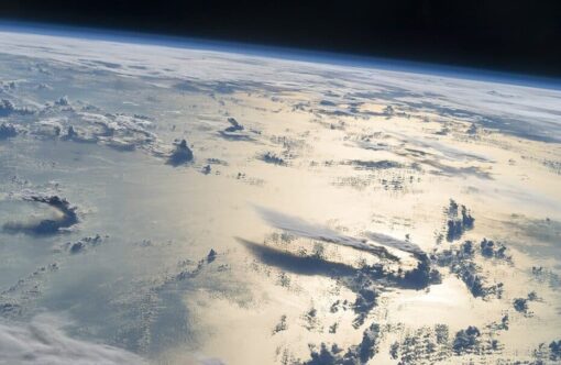 Photo of Earth and clouds from a NASA satellite mission.